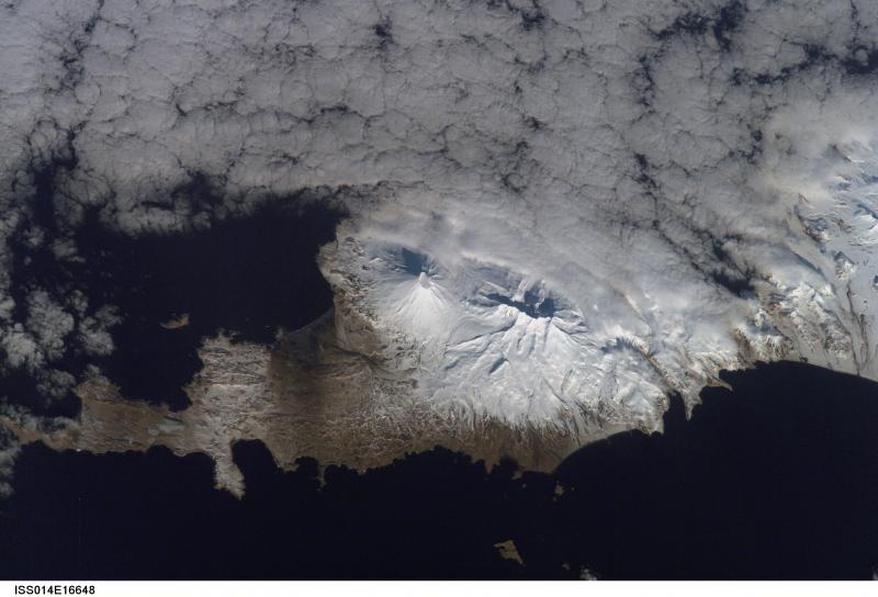 The volcanoes Vsevidof and Rechesnoi, on southern Umnak Island, as viewed from space.
This photograph is mission ISS014, Roll E, Frame 16648 from Image Science and Analysis Laboratory, NASA-Johnson Space Center. "The Gateway to Astronaut Photography of Earth." and is available at http://eol.jsc.nasa.gov/scripts/sseop/photo.pl?mission=ISS014&roll=E&frame=16648