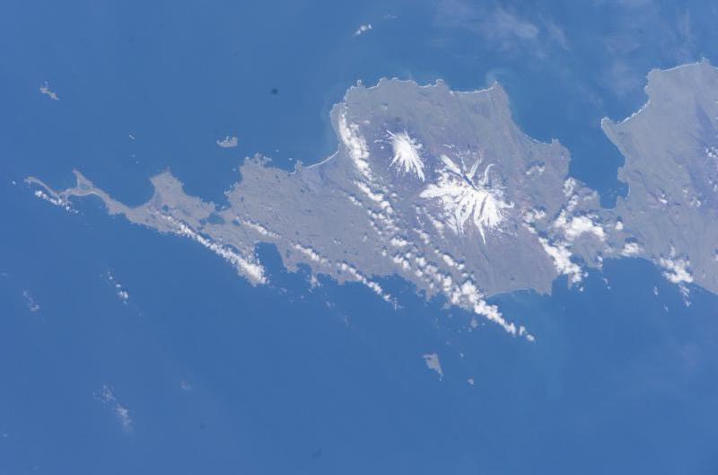 The southwestern end of Umnak Island, as viewed from space. Vsevidof and Recheshnoi are visible. This photograph is mission ISS011, Roll E, Frame 13561 from Image Science and Analysis Laboratory, NASA-Johnson Space Center. "The Gateway to Astronaut Photography of Earth." and is available at http://eol.jsc.nasa.gov/scripts/sseop/photo.pl?mission=ISS011&roll=E&frame=13561