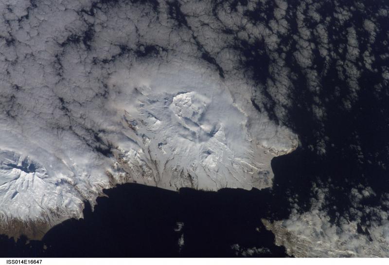 The northeast portion of Umnak Island, as viewed from space.  Okmok Caldera is visible in the center of the image.  Just south of the caldera rim, Tulik volcano, a high cone on the flank of Okmok is visible; historical accounts often erroneously attribute eruptions to Tulik instead of Okmok.   This photograph is mission ISS014, Roll E, Frame 16643 from Image Science and Analysis Laboratory, NASA-Johnson Space Center. "The Gateway to Astronaut Photography of Earth." and is available at http://eol.jsc.nasa.gov/scripts/sseop/photo.pl?mission=ISS014&roll=E&frame=16643