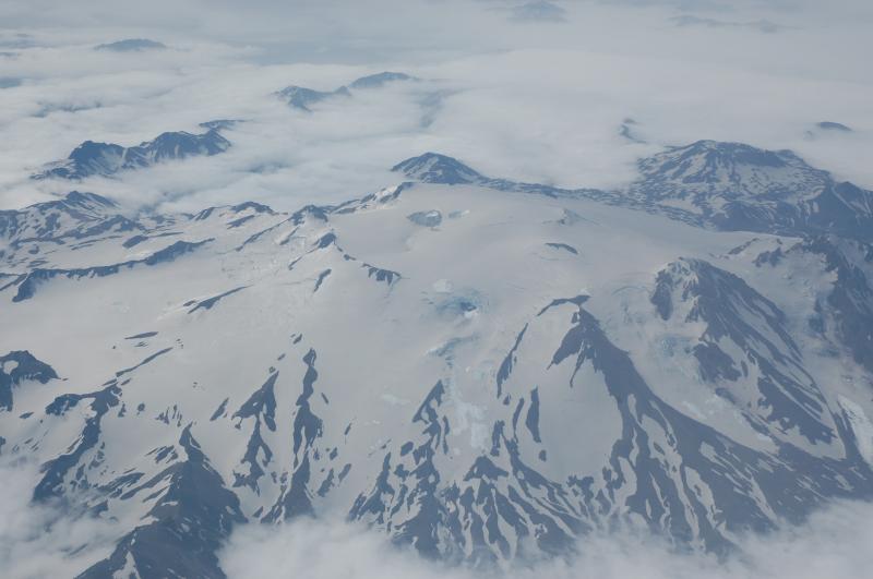 Image of Makushin Volcano, showing ash on snow from July, 2008 eruption of Okmok. Aerial overflight courtesy of Air Station Kodiak, US Coast Guard.