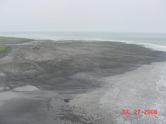 Delta formed by a lahar on Crater Creek.  The "Equinox", the ship wreck on the left side of the photo, used to be in the water even at low tide before the July 2008 eruption of Okmok.