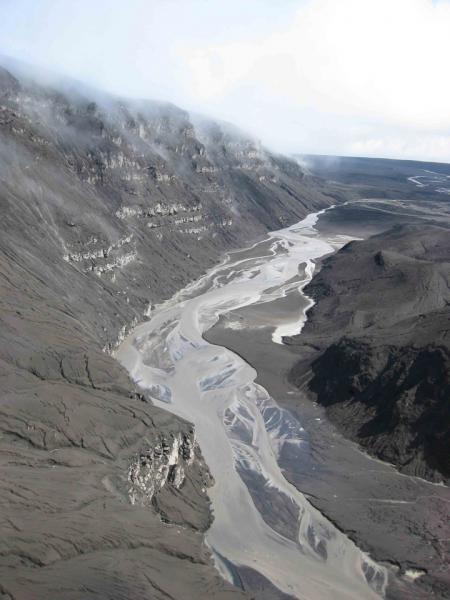 Photograph from August 2 2008 showing the Crater Creek channel near the caldera gates, filled with mud and braided streams, after the lahar activity.