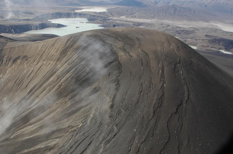 The rim of the new tephra cone; note light colored ballistics (all old lava that we could tell)and subsidence fractures ringing the inner pit.  The new lake is beyond in the distance and Cone H is at upper right.  