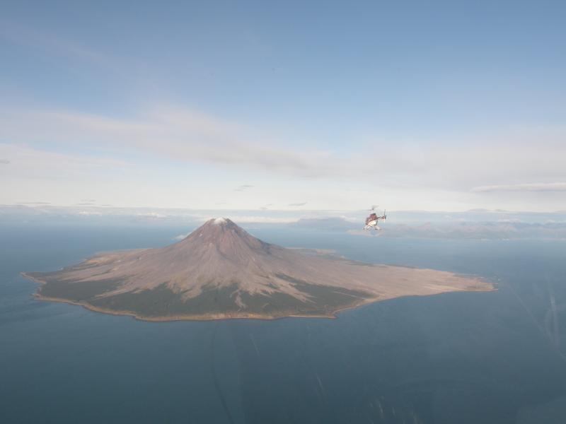 A Pathfinder Aviation helicopter approaches Augustine Volcano.	
