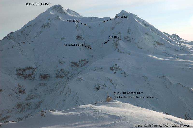 View of the north flank of Redoubt Volcano over AVO's remote Redoubt Hut (aka "Juergen's Hut") (foreground) where we hope a webcam will be located. The hut is approximately 7.5 miles (12 km) from Redoubt's summit crater.				