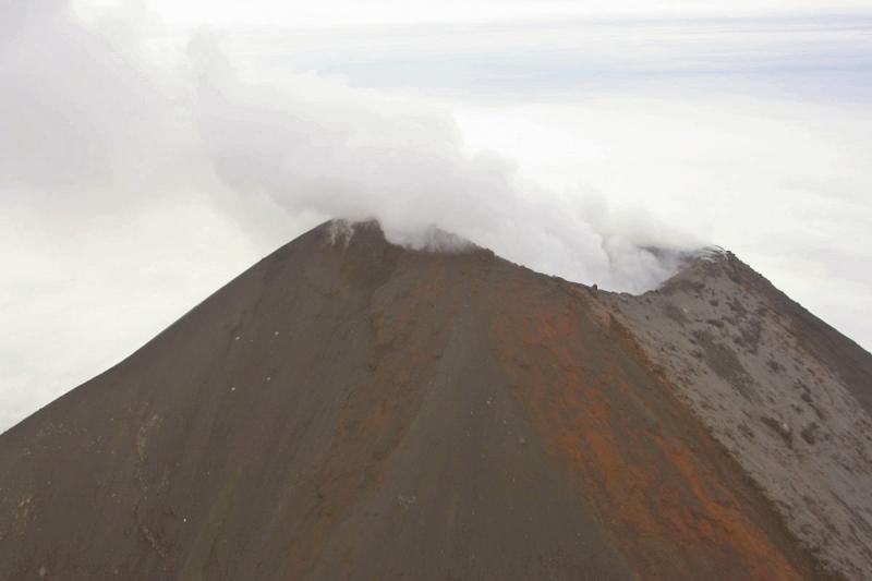 Summit steaming of Cleveland volcano. 	