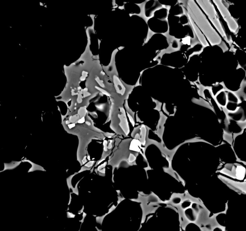 BSE image showing groundmass, with glass, plagioclase, pyroxene, and oxide microlites. The scale bar is absent here, but the image was collected at 400 X, compared with 100 X from image 17485.