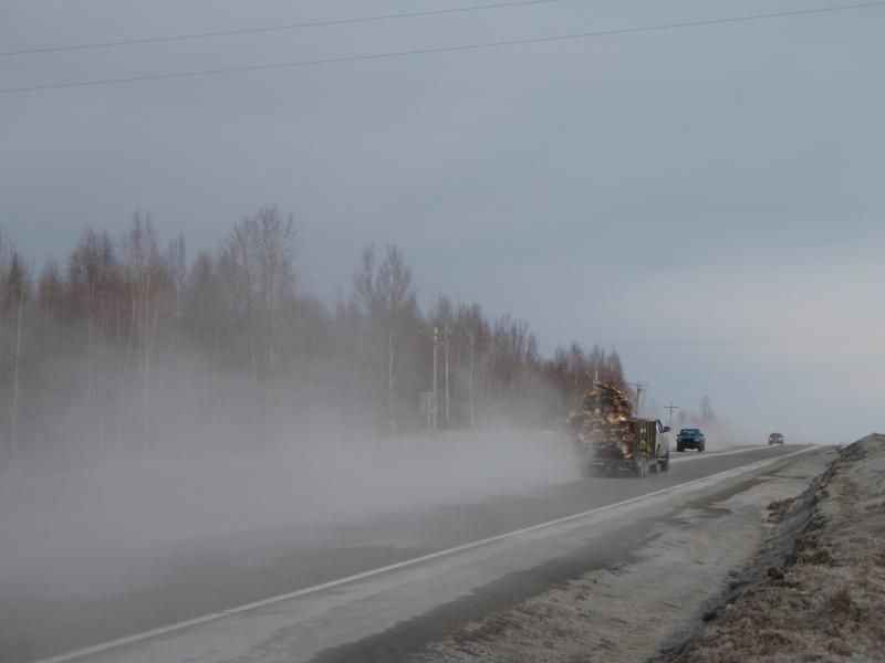 Photograph of impact from the volcanic ash fall out in Nikiski, AK from Redoubt volcano.  This plume was generated during the March 28, 15:29 AKDT, 2009 event, and ash fall began at approximately 16:16 AKDT and lasted maybe 5 minutes.  Fine ash is resuspended as vehicles drive over the recently deposited ash fall deposit.