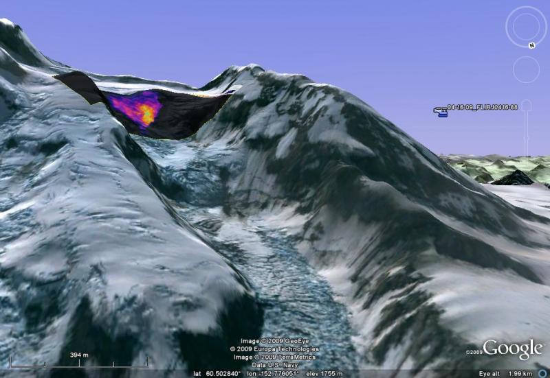 				FLIR image taken by Rick Wessels (USGS) draped on top of a Google Earth representation of Redoubt from April 16 2009.  The lava dome is seen at the summit, warmer colors indicate higher temperatures.  The location of helicopter is on the left at about 2.25 km from the dome.   The dome temperatures recorded today were about 420Â°C, which match well to derived temperatures from thermal satellite imagery.  Extrusion rates were estimated for this image and a NOAA satellite image 30 minutes later to be about 0.8 m^3/s. 				