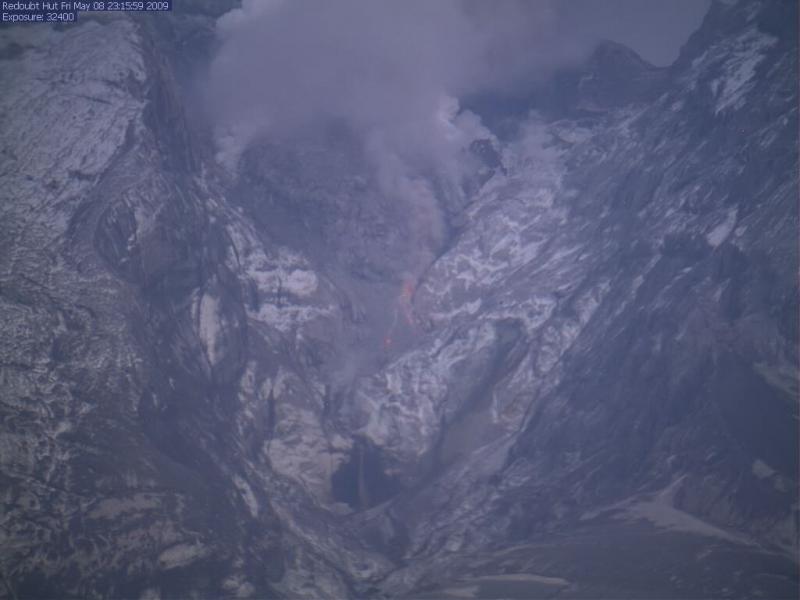 Incandescent rockfall on the Redoubt lava dome can be seen in this hutcam image from 5/8/09 at 11:15 pm.				
