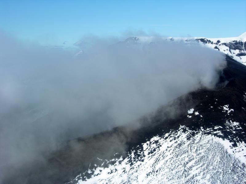 																								Intracaldera cone at Veniaminof with steam and ash plume.		