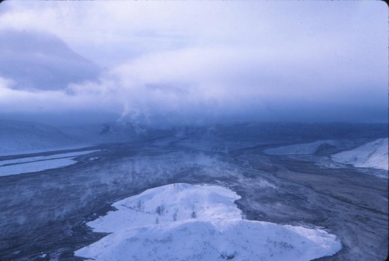 																																					View west across the Dumbbell Hills of the still-warm lahar deposit generated by collapse of the lava dome that had grown since about January 16, 1990, and failed on February 15, 1990.					