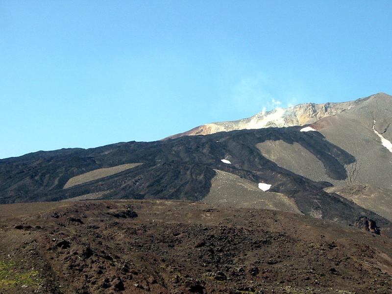 Picture of Gareloi volcano, with 1929 lava flows in foreground.				