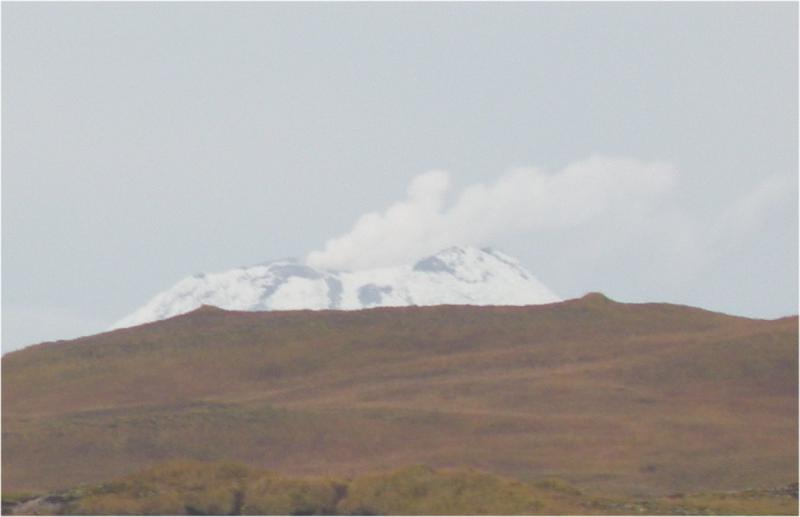 This photo of Kanaga was taken 10-12 at ~10:30 am from the fish plant wharf in â€œdowntownâ€ Adak.  We drove up to White Alice to get a view of the whole volcano but by the time we got there, the clouds had rolled in and we could no longer see it.  				