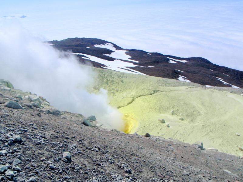 Active fumarole on Kiska - the yellow coloring is sulfur. Photograph courtesy of Alex Bond. 				