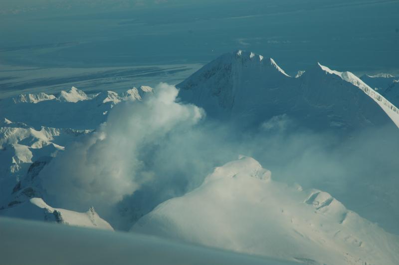 Photographs of Redoubt Volcano during aerial inspection and gas measurement flight on December 31, 2009.

Note the brownish hazy cloud drifting south-southeast from the volcano; this cloud contains volcanic gas only, there is no ash present.  