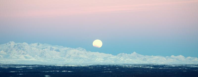 						Partial lunar eclipse over northern Cook Inlet and Tordrillo Mountains.		