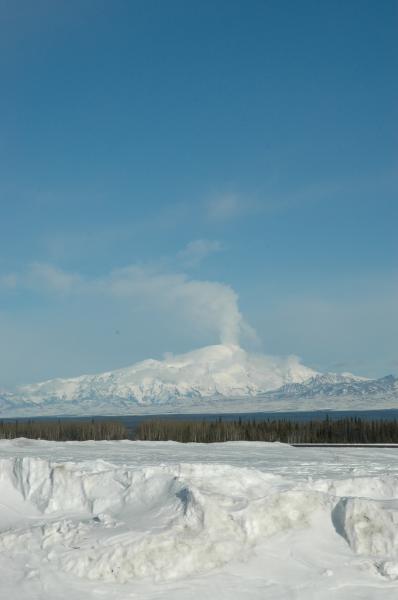 Apparent plume rising from Mt. Sanford in the Wrangell mountains east of Glennallen. This is either meteorological, or, the result of an ice/snow fall down the 5,000-foot shear south face of Sanford. This view is from the Gulkana Airport.
