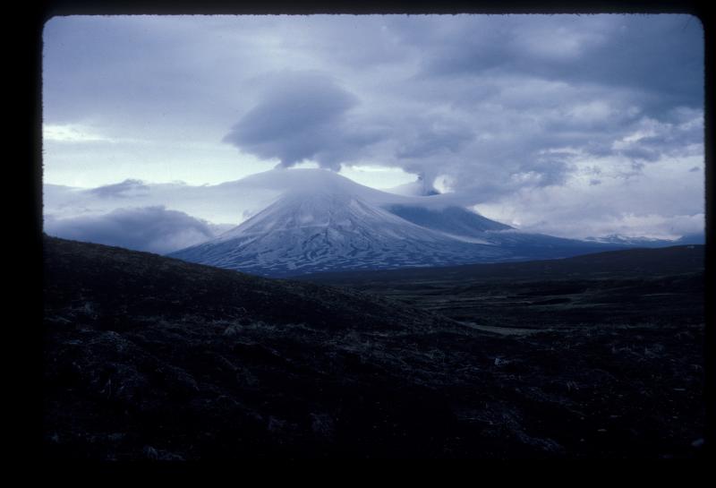 							Pavlof eruption June 1986. Pavlof Sister enshrouded in lenticular clouds as Pavlof erupts in background.  Photograph courtesy of Don Richter.