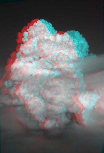 Anaglyph (3-D) image of a view looking north of a Westdahl eruption plume on December 4, 1991. Photographs taken by Christina Neal, AVO/USGS. Anaglyph created by Peter Lipschutz. For best viewing, use red-blue glasses, with left eye red.			
