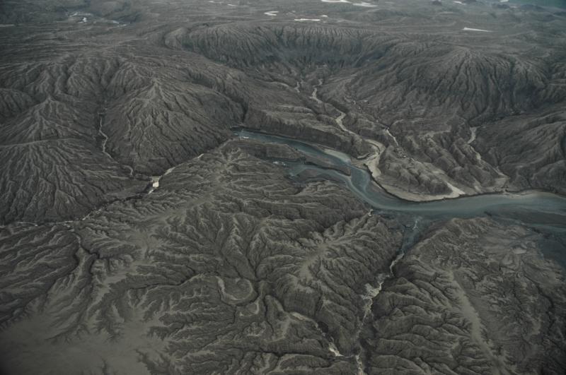 Headwaters of Crater Creek within Okmok caldera. The 2008 eruption temporarily changed the pattern of water drainage from the caldera. Crater Creek carries surface water out of the Okmok caldera and down the north flanks of the volcano.