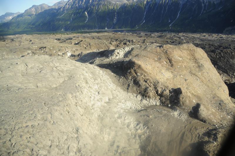 Nunatak (Tuya), lower Drift Glacier, north of Redoubt Volcano. Exposures of the complete Nunatak were revealed after melting of adjacent glacier ice during the 2009 eruption of Redoubt. The columnar basaltic andesite lava is visible here, as well as underlying and marginal breccias. 