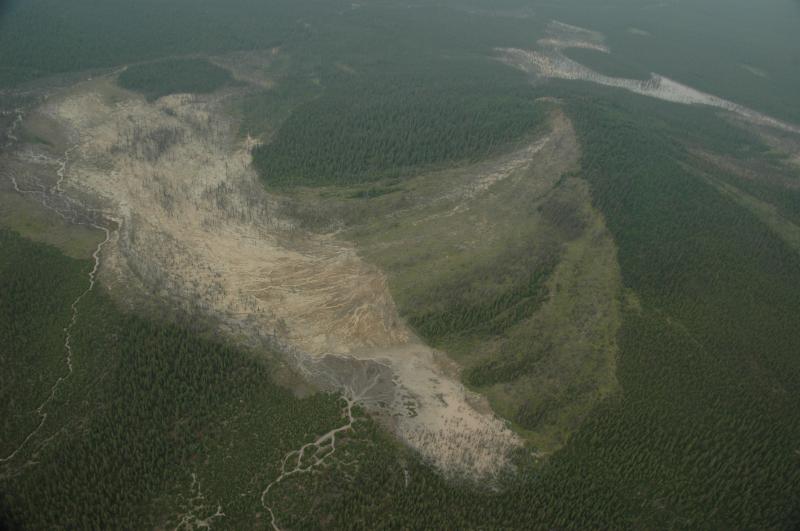 Aerial view from the northeast of Shrub mud volcano, located about 17 miles (27 km) east of Glennallen, Alaska. Vegetation-kill resulted from onset of eruption in summer 1997.				