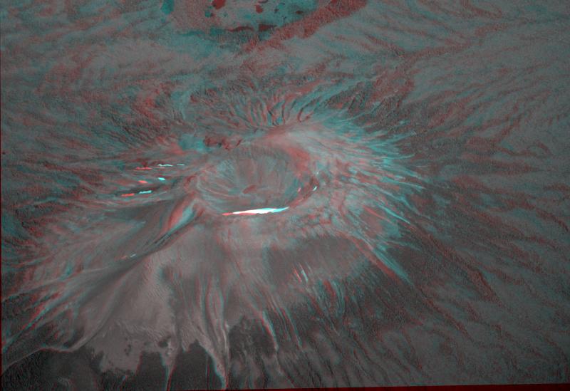 Anaglyph (red-blue 3D image) of Mount Edgecumbe's unvegetated cone (with vegetated Crater Ridge in the distance), made by Peter Lipschutz from photographs taken from an Alaska Airlines flight by Willie Scott. To view, use red-blue glasses with left eye red. 
