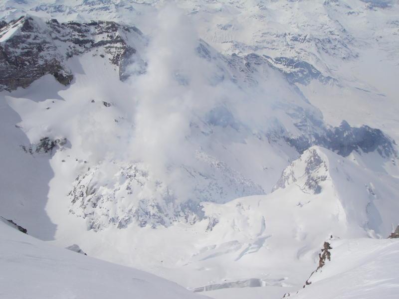 Photo taken during May, 2011 ascent of the NW ridge of Redoubt Volcano by Marcin Ksok and Gregory Encelewski. The 2009 lava dome can be seen steaming in the crater below.				