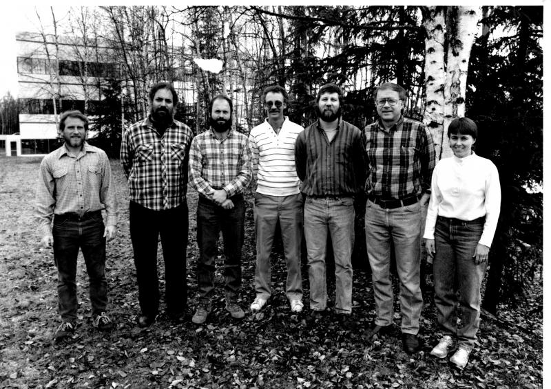 The Anchorage AVO staff in April 1991. From left to right: Game McGimsey, Mike Doukas, John Paskievitch, Dave Meyer, Joe Dorava, Tom Miller, Tina Neal (Not shown: Don Richter and Inyo Ellersieck). Photo courtesy of Tina Neal, USGS.