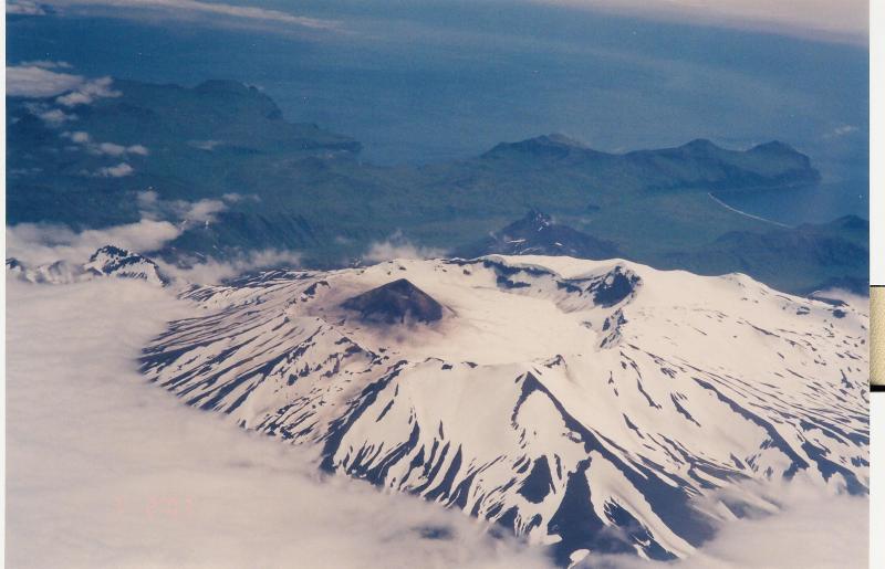 Aerial view of Akutan's summit caldera and intracaldera cone, looking southeast. Photograph was taken from Alaska Airlines flight 21 by Jeff Wynn.
