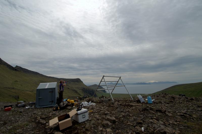 Helena Buurman works on station AKMO with Makushin Volcano in the background.