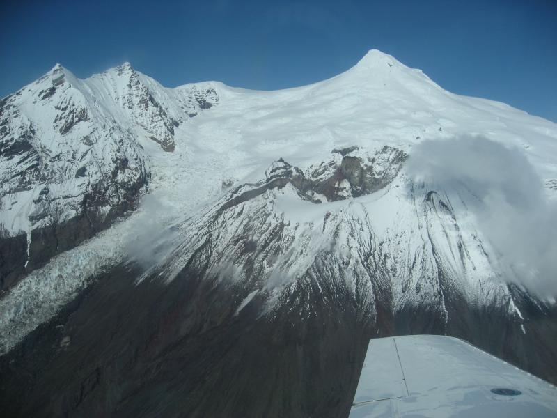 Aerial view from S of the Crater Peak vent (foreground) and the summit of Mount Spurr volcano.  