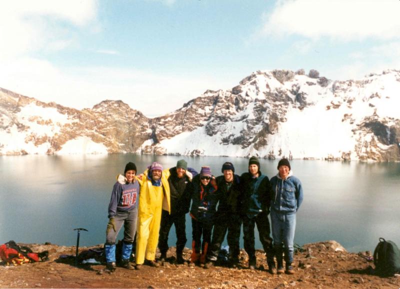 John Eichelberger with a group of AVO students at the rim of Katmai caldera. From left to right: Angie Roach, John Eichelberger, Darren Chertkoff, Michelle Coombs, Peter Stelling, Kirby Bean, Pavel Izbekov. Photograph is taken by Maggie Mangan.