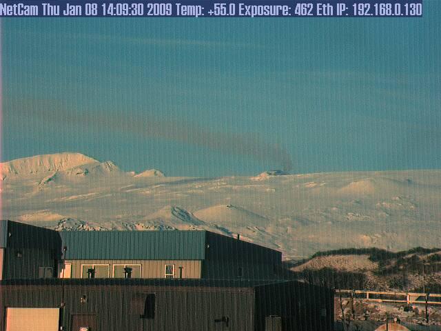 Steam plume rising and trailing from the intracaldera cone of Veniaminof Volcano.  The plume was reported by a pilot to be between 6,500 and 10,500 ft, and extending 15 nautical miles downwind (to the east-northeast).  See also image 16219.