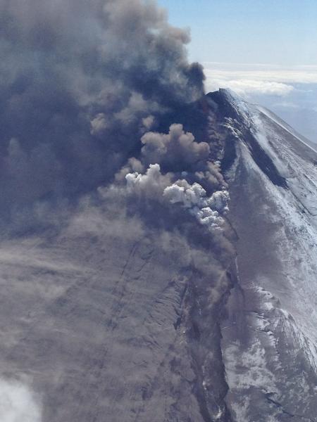 Pavlof in eruption, with ash, steam, and gas plume. Photograph courtesy of Brandon Wilson. May 17, 2013.
