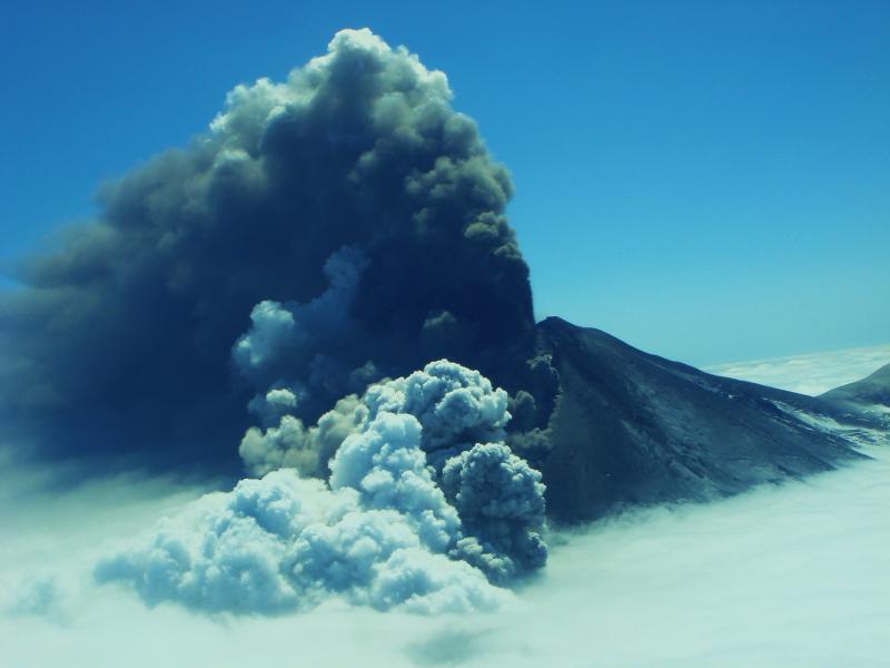 Pavlof volcano with ash eruption plume and steam from melting snow and ice. Photo courtesy of Theo Chesley.
