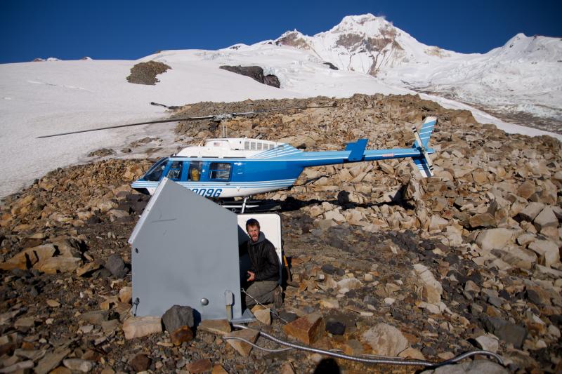 Dane Ketner installs the webcam at station IVE on the east side of Iliamna Volcano.