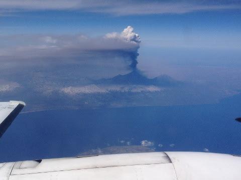Photograph of Pavlof erupting as seen from 28,000 feet at about 4 p.m. June 2, 2014.
