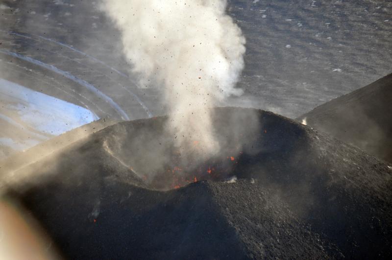 Lava bombs are hurled skyward from the erupting cinder cone of Veniaminof volcano.