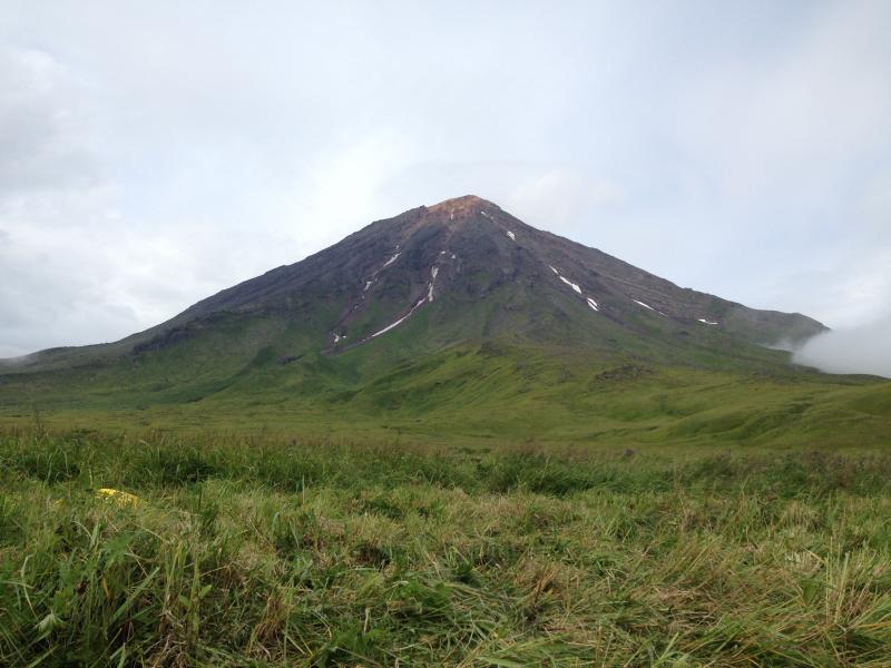 Southeast flank of Carlisle volcano.  Photo taken during the 2014 field season of the Islands of Four Mountains multidisciplinary project, work funded by the National Science Foundation, the USGS/AVO, and the Keck Geology Consortium.