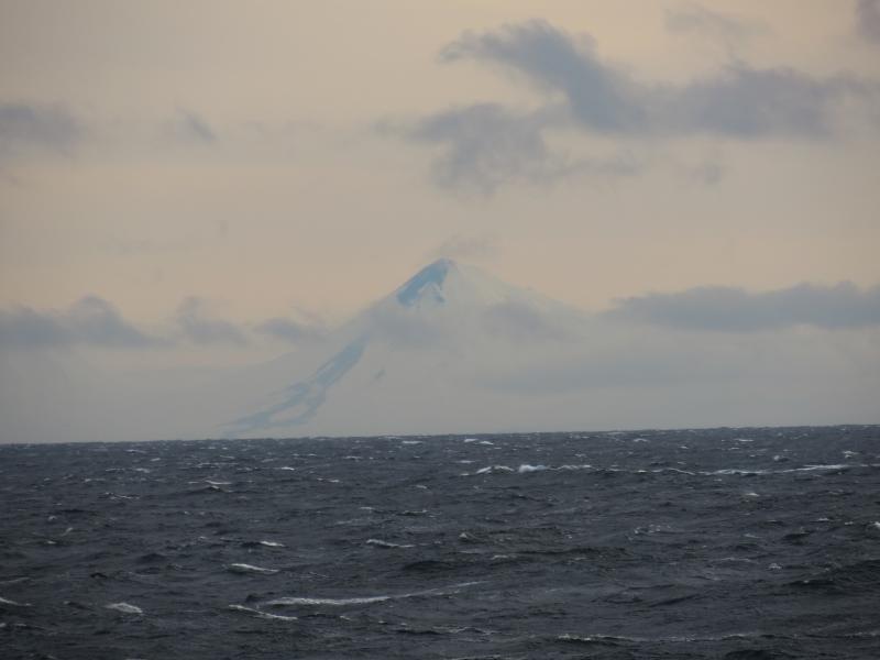 Lava flows and lahar deposits on the northwest flank of Pavlof volcano. Photo taken approximately 50 miles WNW of Pavlof aboard a fishing vessel on the afternoon of November 26, 2014. Photo courtesy of Levi Musselwhite.