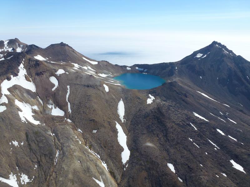 Lake along the summit ridge of Tana Volcano, Chuginadak Island. Photographs from fieldwork in the Islands of Four Mountains, July and August 2014.
