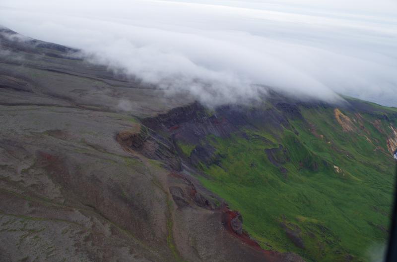 Outcrops at the SW flank of Herbert Volcano, Central Aleutians. Photo taken during the 2014 field season of the Islands of Four Mountains multidisciplinary project, work funded by the National Science Foundation, the USGS/AVO, and the Keck Geology Consortium.