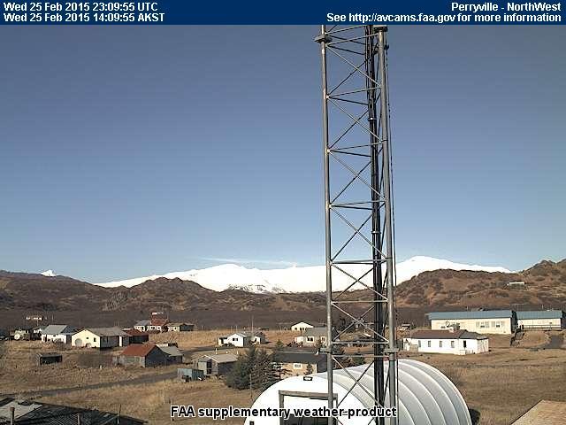 Looking closely at the intracaldera cone (visible just to the left of the tower in this image), a low-level degassing plume is visible at Veniaminof. Photo from the FAA Perryville webcam, February 25, 2015.