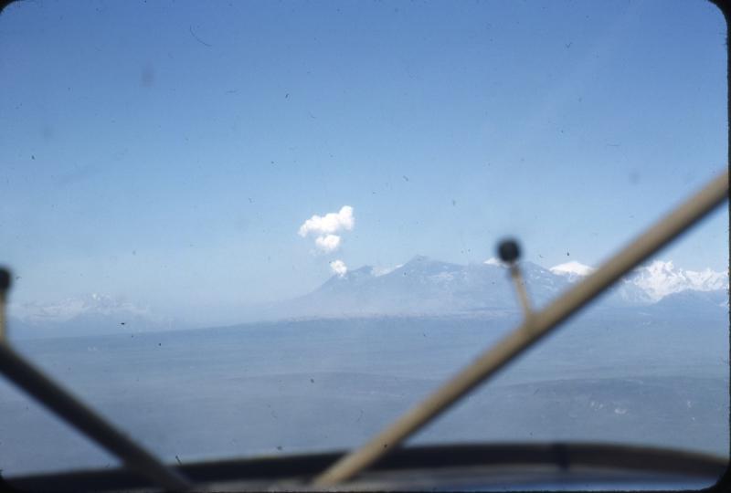 Steam plume rising from the Crater Peak vent on Mt. Spurr volcano.  Photo taken on morning of July 11, 1953, following the July 9 eruption that dropped 6 mm of ash on Anchorage.