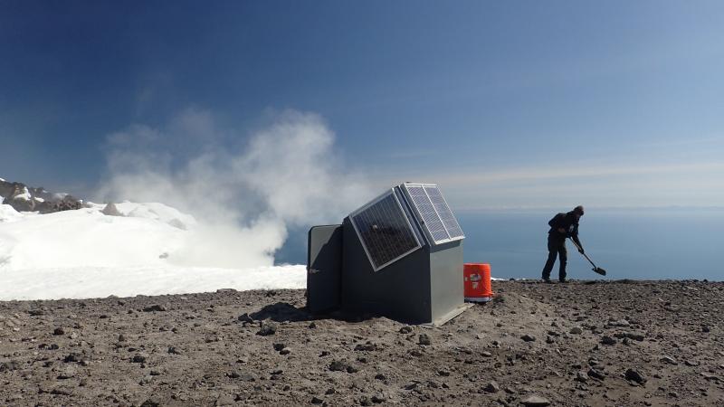 Installation of joint MultiGAS/seismic station AUSS on summit of Augustine by Dane Ketner (USGS-AVO) and Peter Kelly (USGS-CVO), June 12 &amp; 13, 2015.  In this image, Dane Ketner is beginning to dig the hole for the seismic vault.