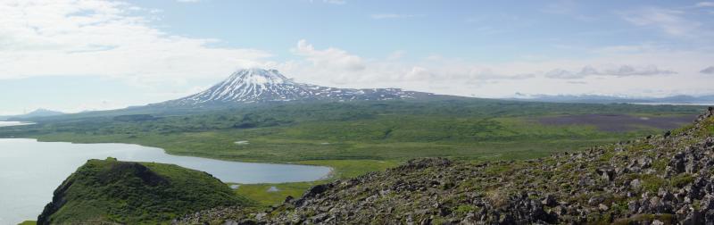 Panoramic view of Peulik Volcano and Ukinrek Maars from the top of Gas Rocks, Becharof  Lake.  The maars are located in the gray-colored middle ground at far right side of image.  The hummocky ground center left in image is a debris avalanche deposit from Peulik.