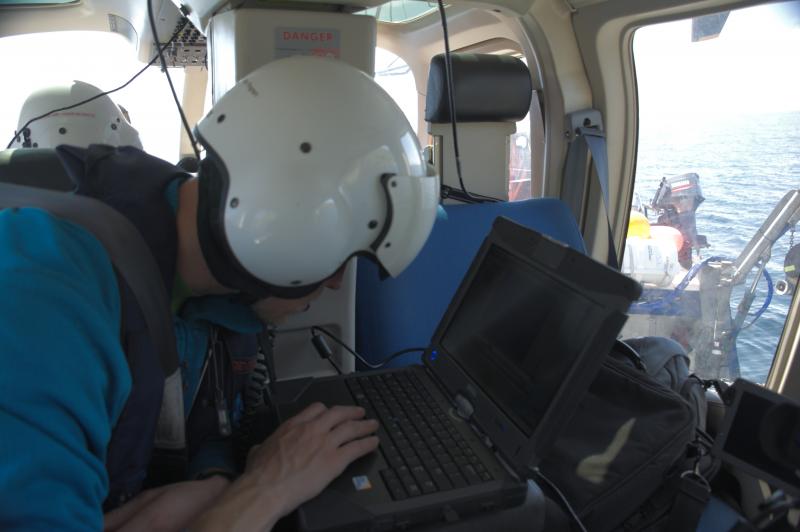John Lyons preparing thermal camera for a summit overflight of Cleveland Volcano. Photo taken during the 2015 field season of the Islands of Four Mountains multidisciplinary project, work funded by the National Science Foundation, the USGS/AVO, and the Keck Geology Consortium. 