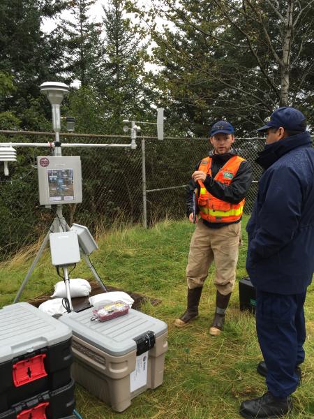 AVO installing particulate monitors on Kodiak Island, to study resuspended 1912 volcanic ash and whether or not it presents a health hazard to humans. In this image, AVO is training the USCG on the monitor&#039;s operation and maintenance.